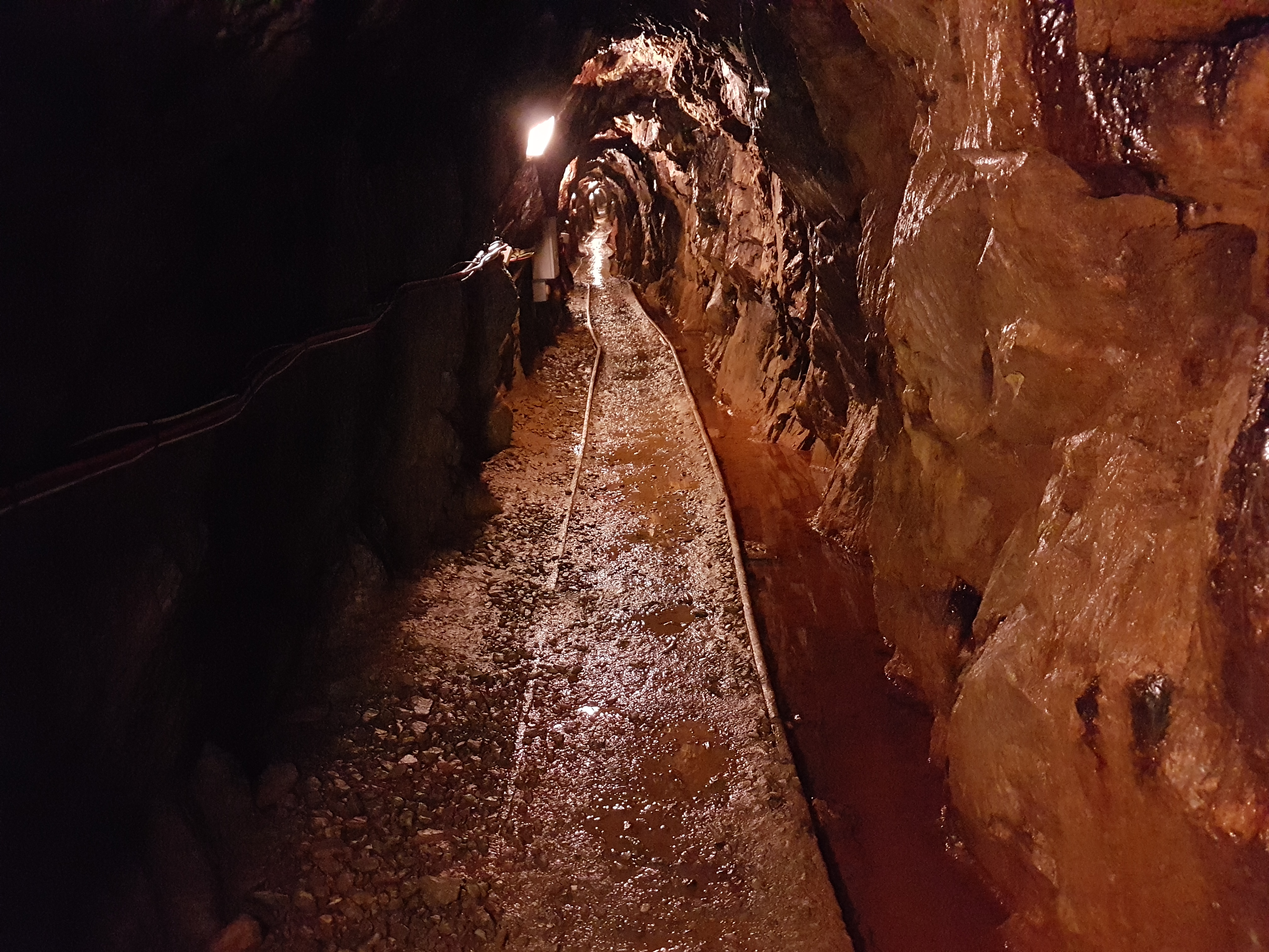 A representative underground hard-rock mine tunnel, not the Beaver Brook mine